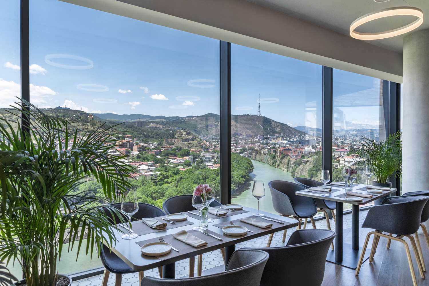 TITA Restaurant window seating with river and city panorama